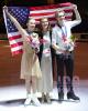 Gold - Leah Neset & Artem Markelov (USA) with coach Elena Dostatni